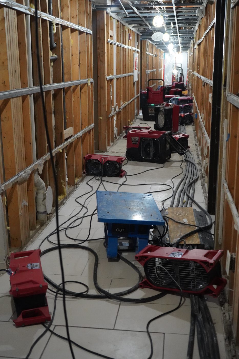 Commercial drying equipment staged in a Sterling Heights home after water damage