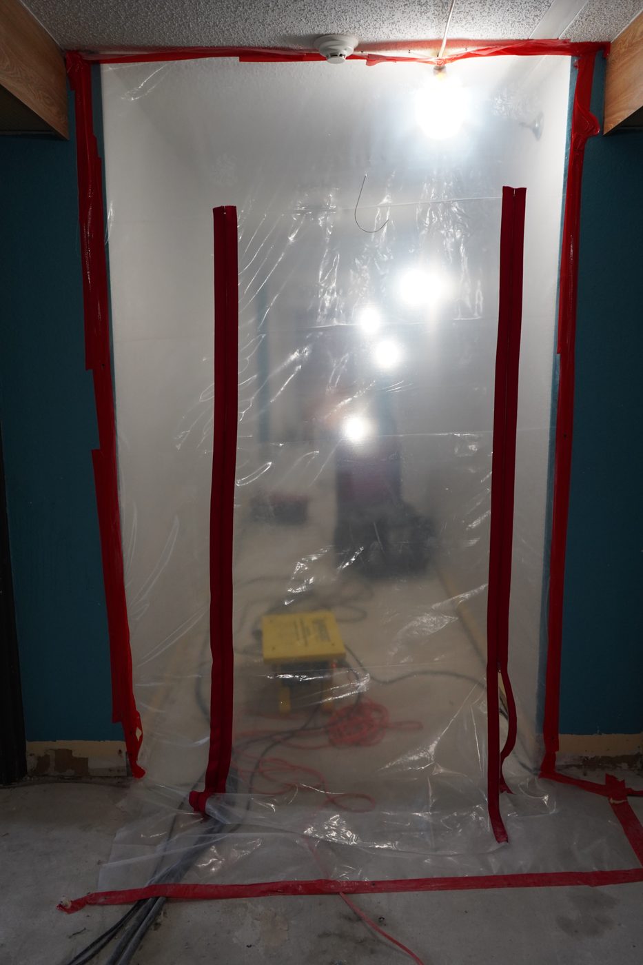 Furniture wrapped and protected during water damage drying